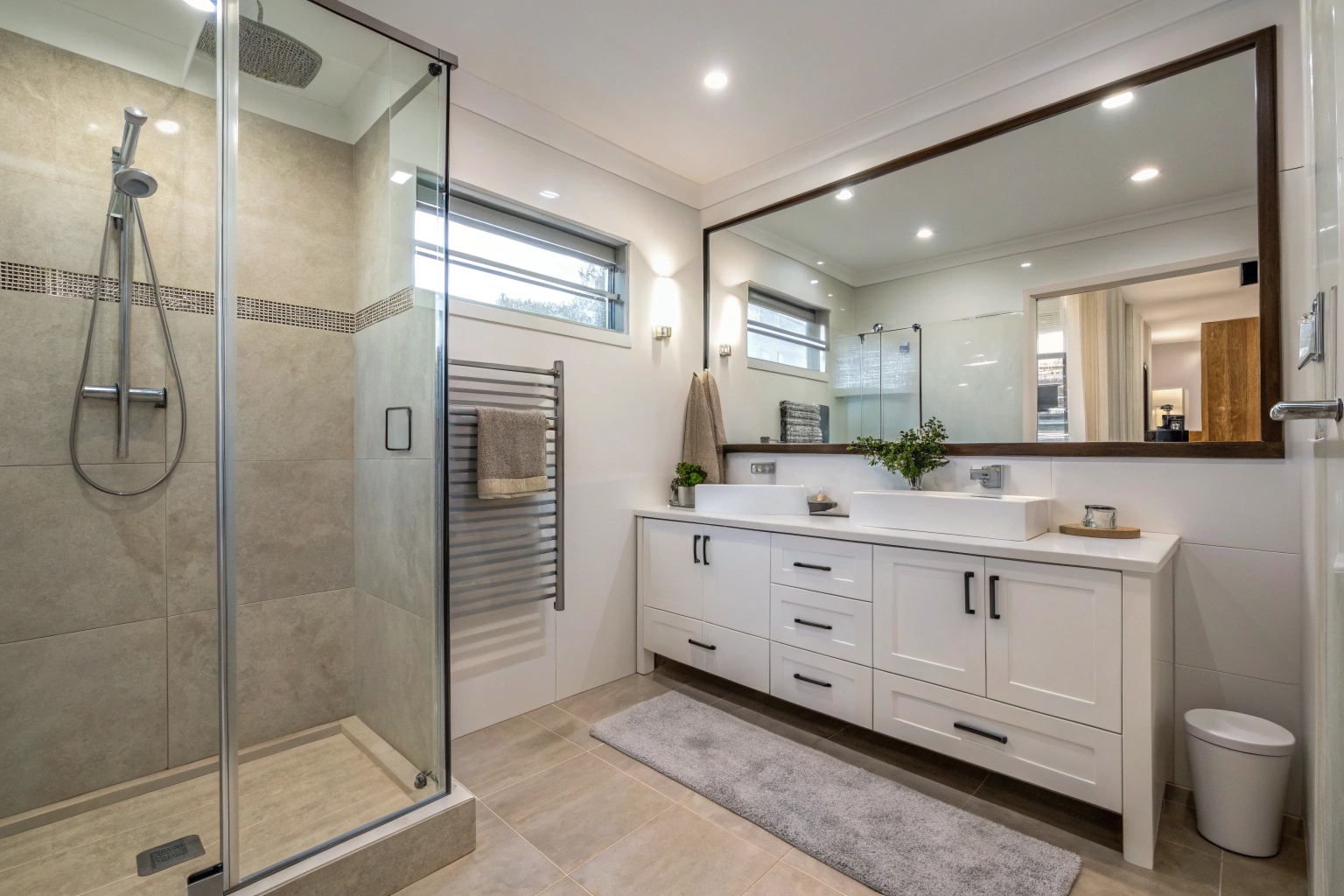 Full ensuite bathroom renovation in Newcastle showing shower, vanity and heated towel rail layout